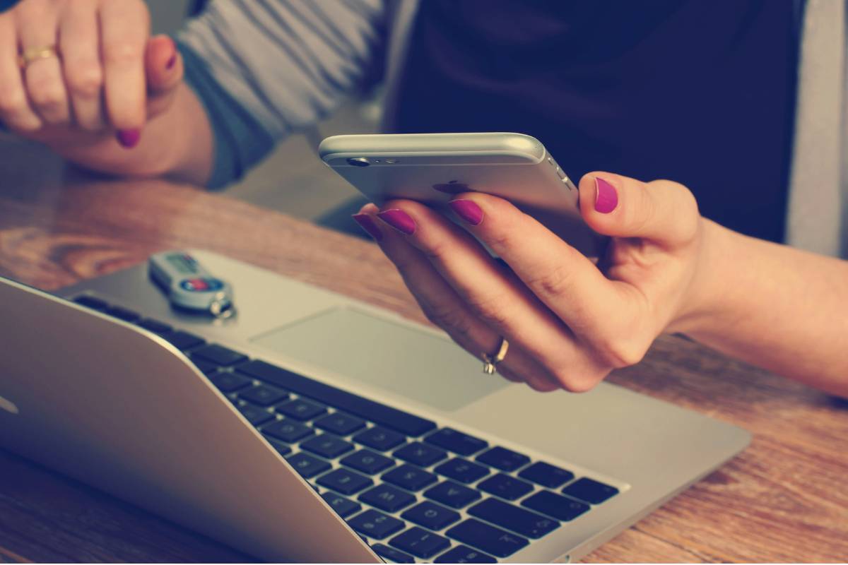 Lab manager accessing CMT lab management software on mobile and desktop devices